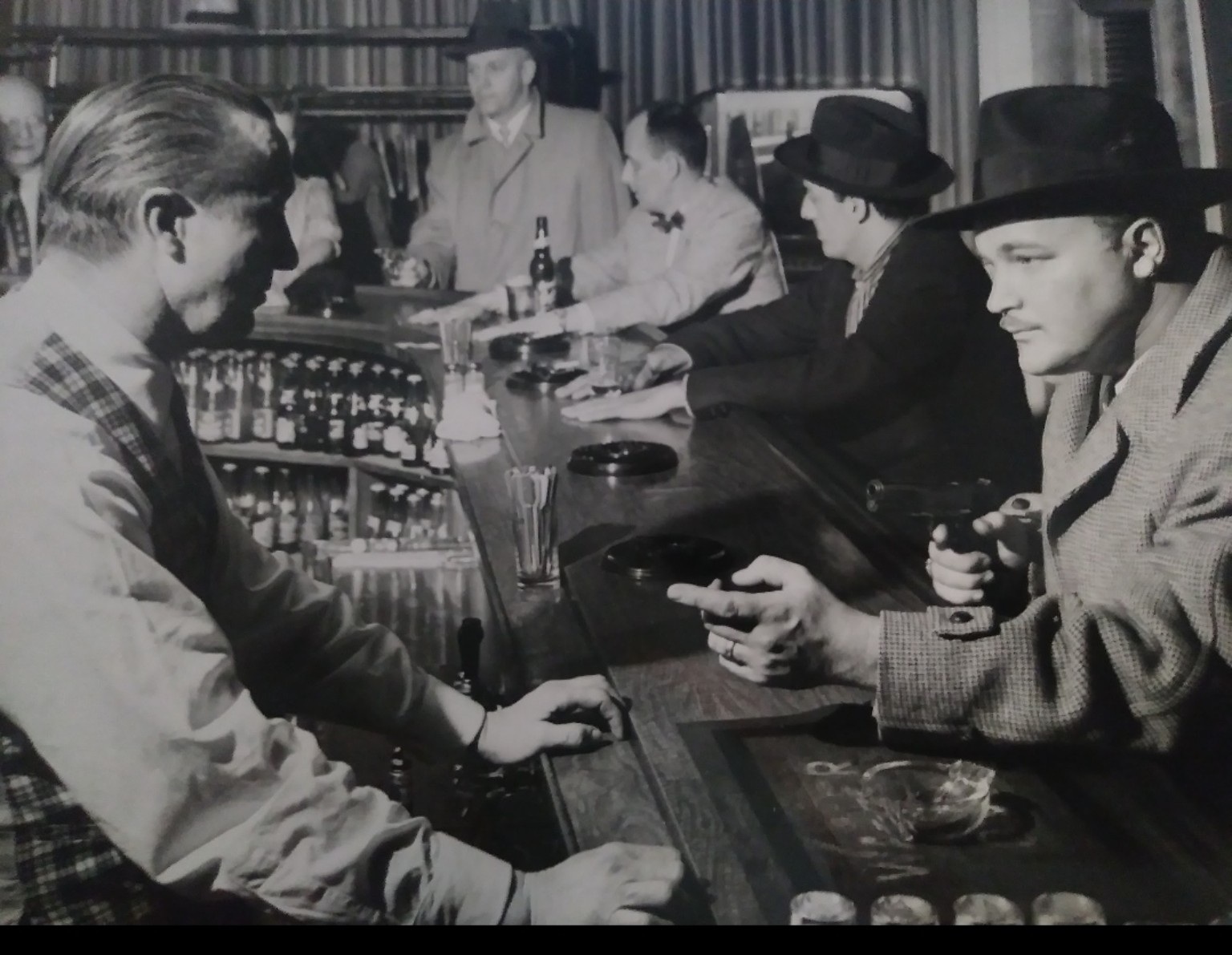 Archival robbery demonstration photograph at a Detroit bar