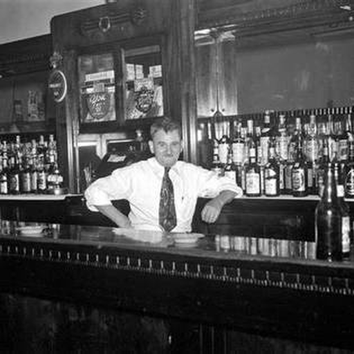 Historic Detroit bartender behind a bar