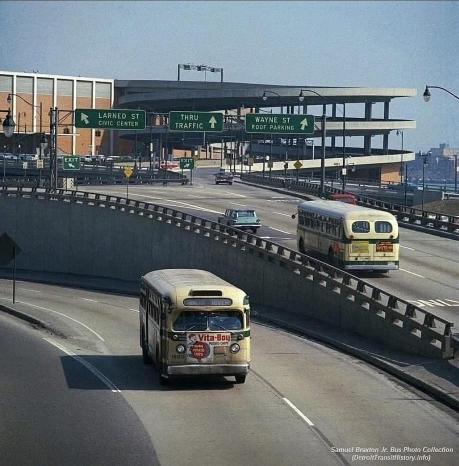 Detroit expressway traffic and city buses near the Civic Center