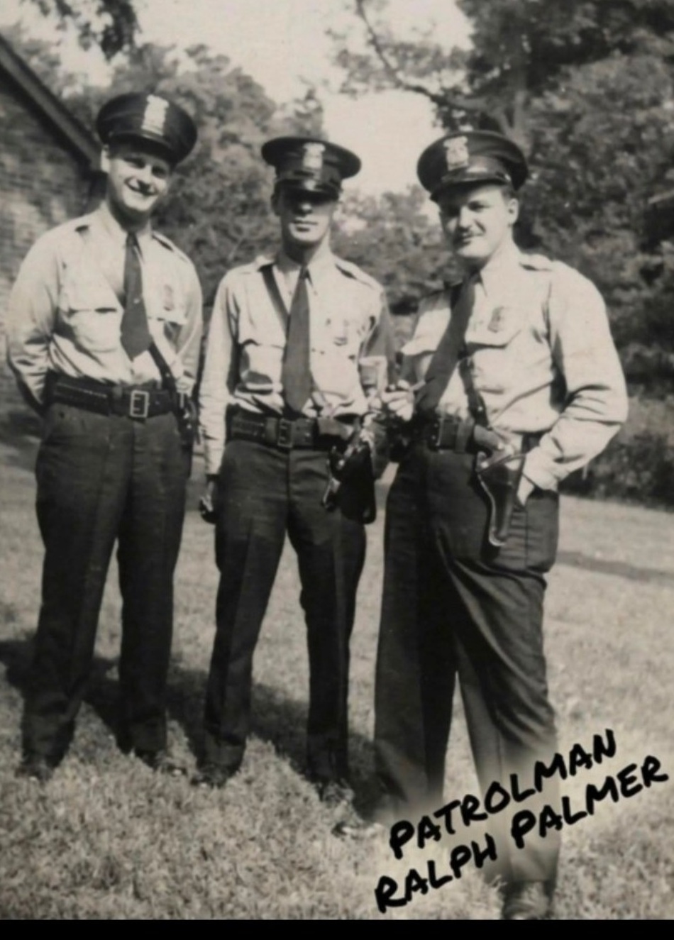 Three Detroit police patrolmen, with Ralph Palmer at right